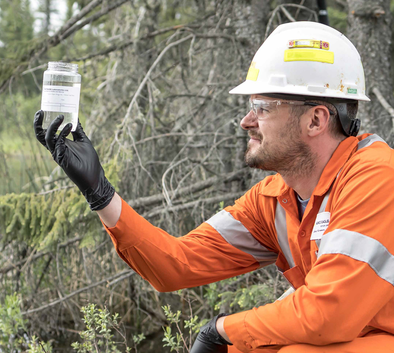 person measuring water quality